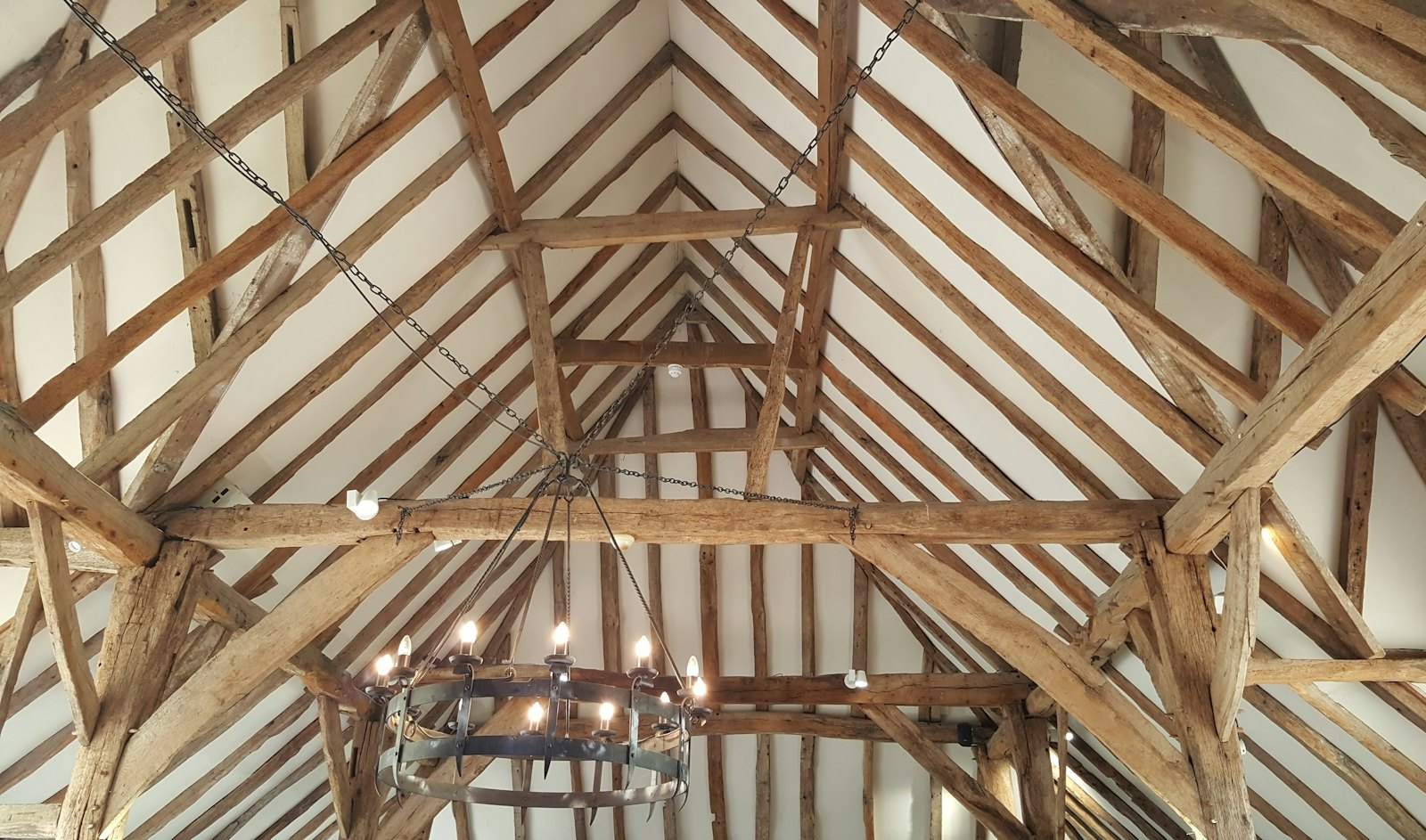 Exposed oak roof timbers in a converted building