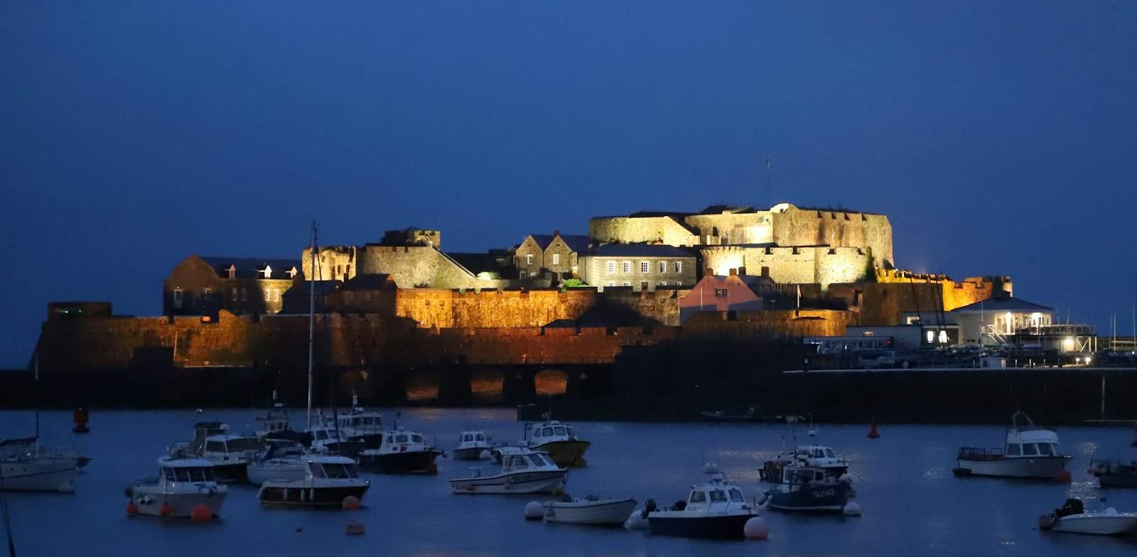 Castle Cornet lit up at night in St Peter Port, Guernsey
