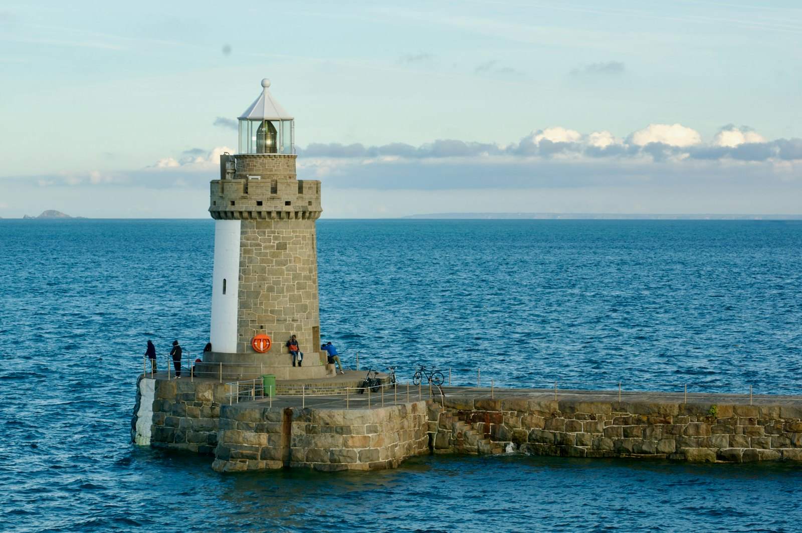 Lighthouse at the end of a harbour pier in Guernsey