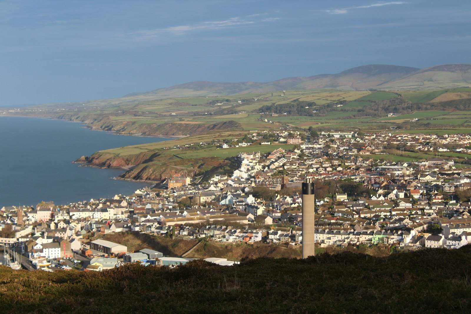 A coastal town on the Isle of Man seen from the hills