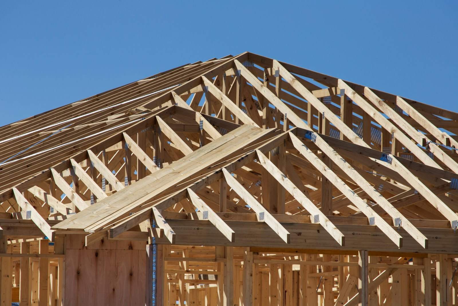 Roof trusses being fitted on a partly built house