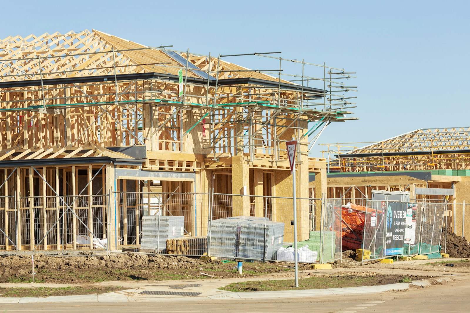 Timber frame houses part built with scaffolding